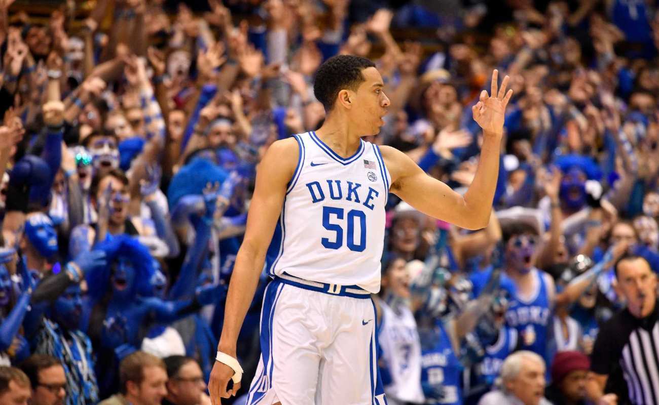  Justin Robinson of Duke Blue Devils reacts after making a three-point basket during basketball game