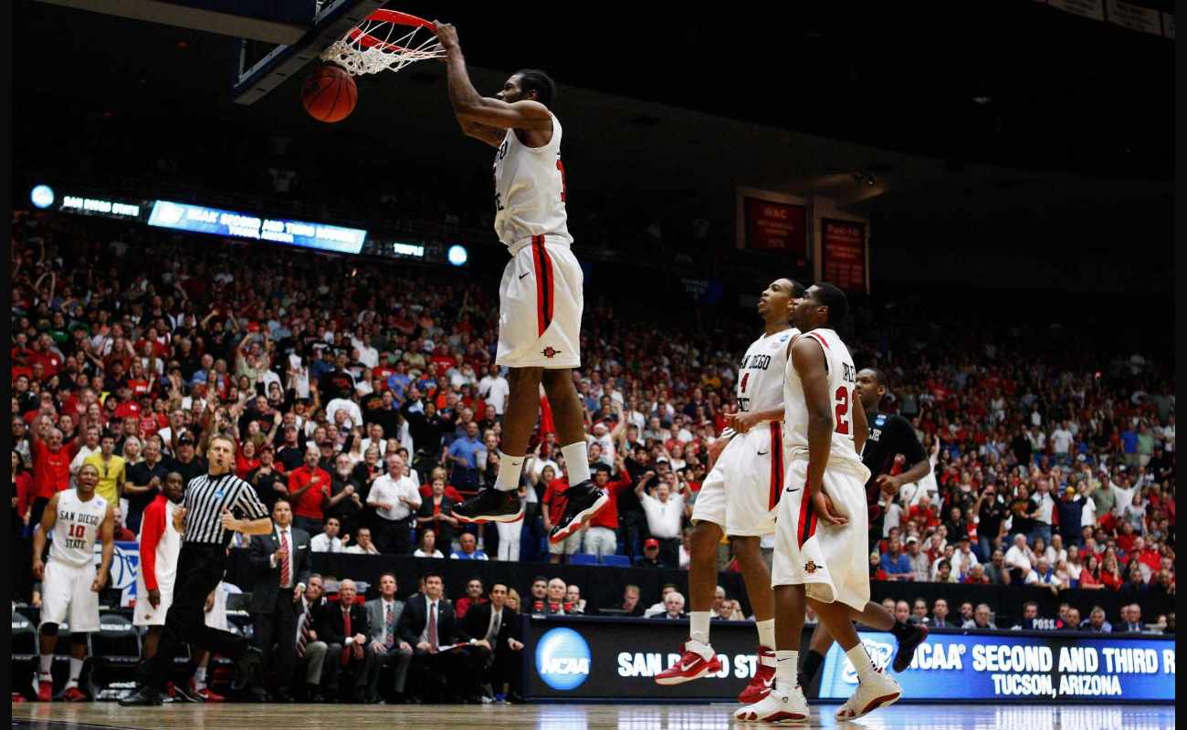 Kawhi Leonard #15 of the San Diego State Aztecs scores the final basket  against the Temple Owls at 2011 NCAA men's basketball tournament