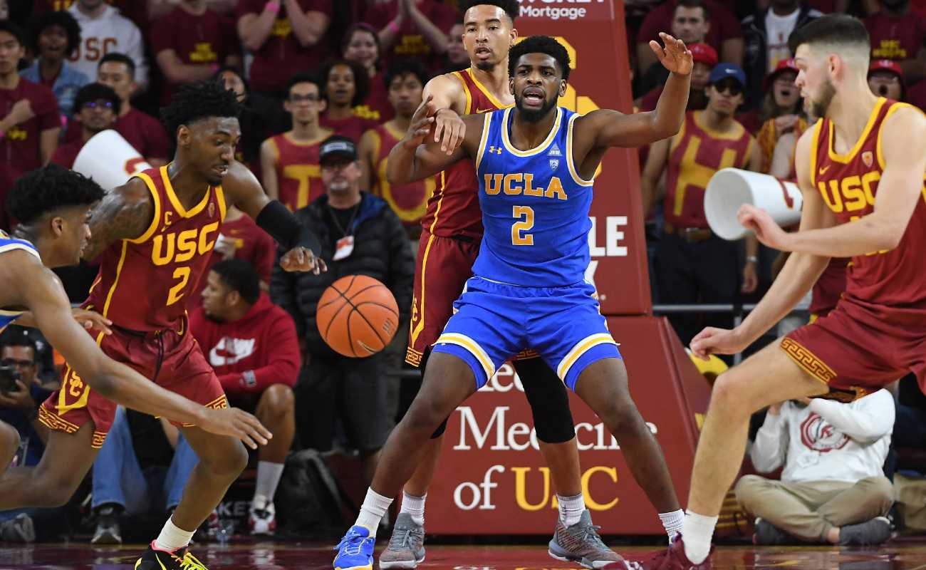Jonah Mathews of USC Trojans chases down ball in basketball game at Galen Center 