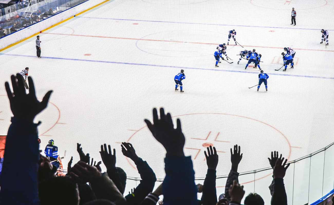 Hands of fans during ice hockey game