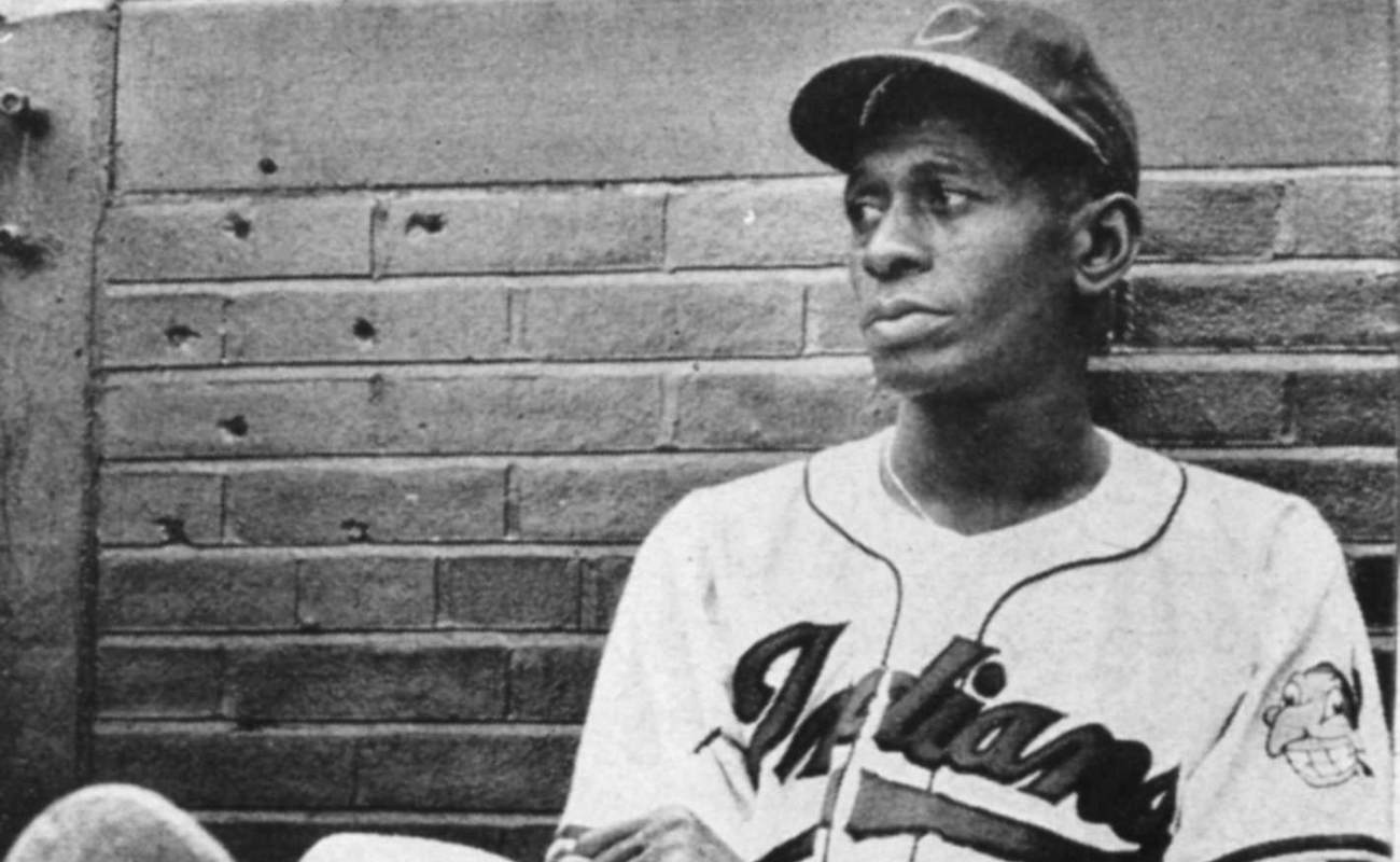 Satchel Paige resting against wall at Metropolitan Stadium in Cleveland in 1948