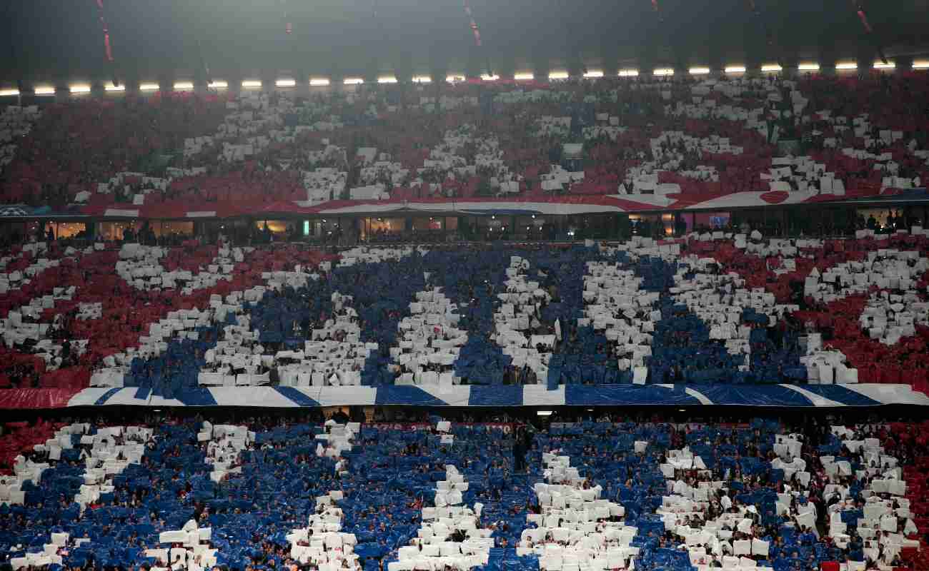 Bayern Munich fans create their team’s badge in the stands