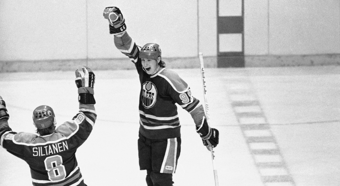 Edmonton Oilers Wayne Gretzky, right, shows his joy after registering his fourth goal in the game against the Philadelphia Flyers in Philadelphia, March 7, 1981, as teammate Risto Siltanen comes to congratulate him. Edmonton beat the Flyers 5-3. 